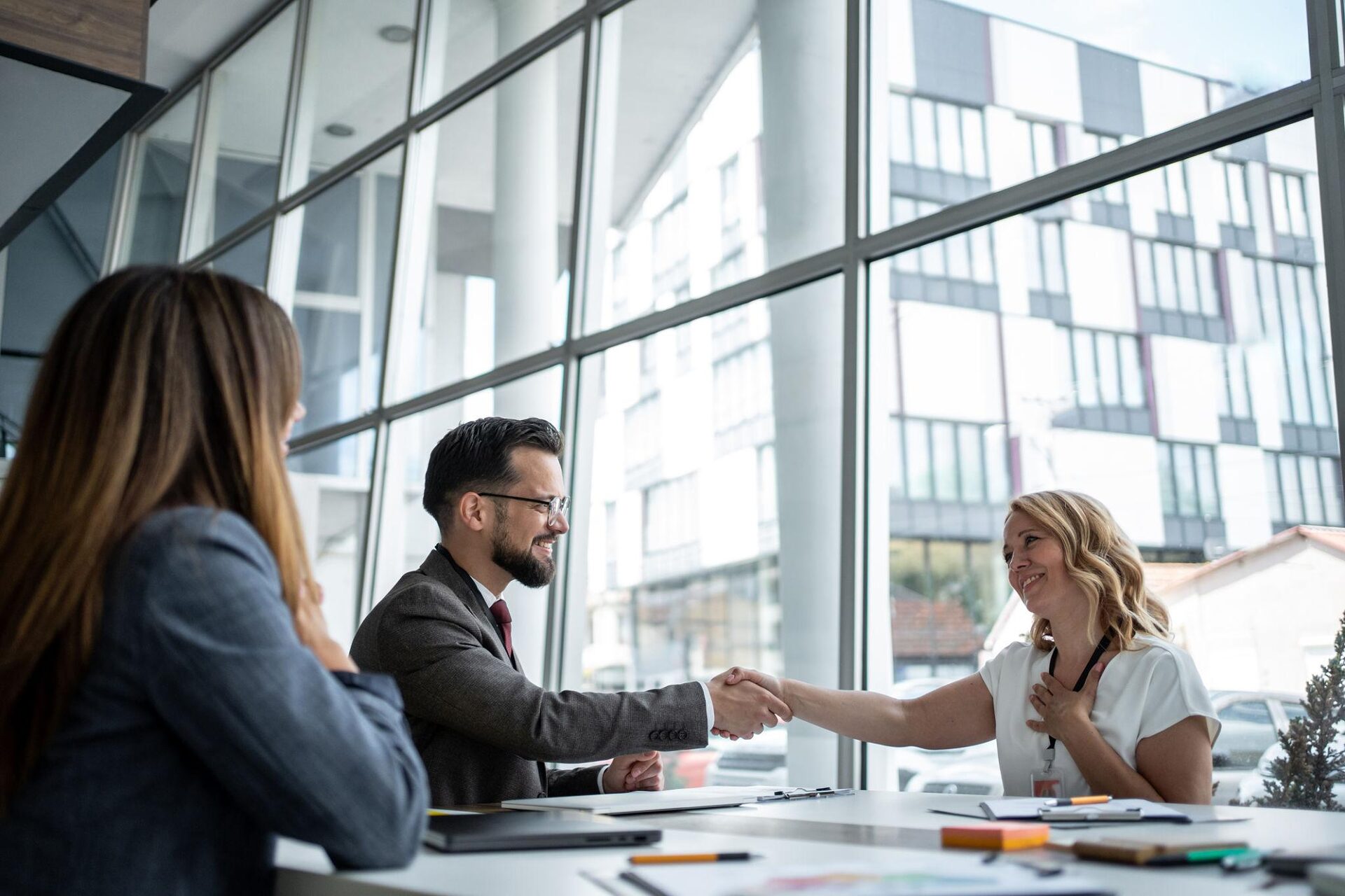 Successful partnership handshake between business professionals